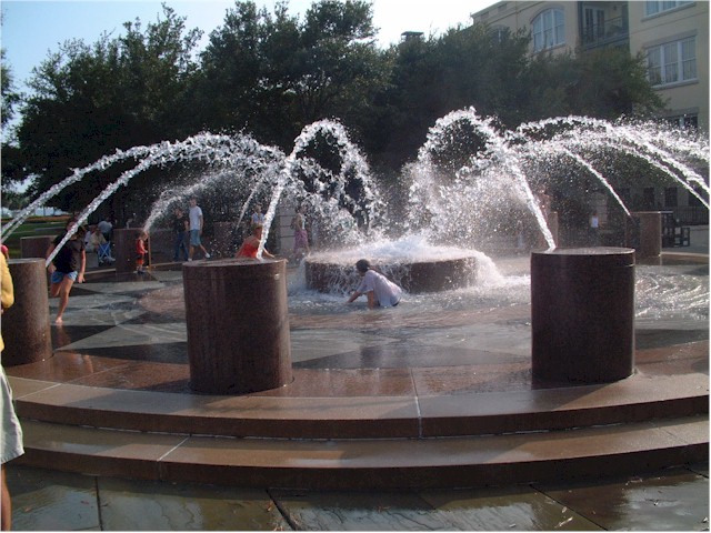 Children cooling off in the fountains in Charleston, South Carolina.
