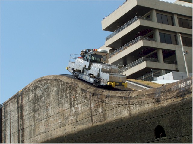 A 'mule' locomotive helps tow ships into the locks.
