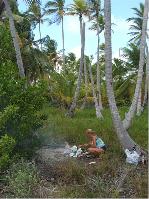 We visit a deserted island to burn and bury our garbage...