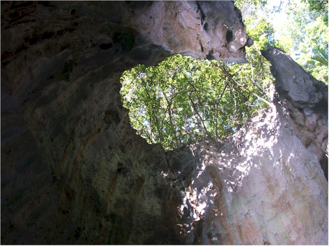 ... lit by sun shining through a hole in the high roof.
