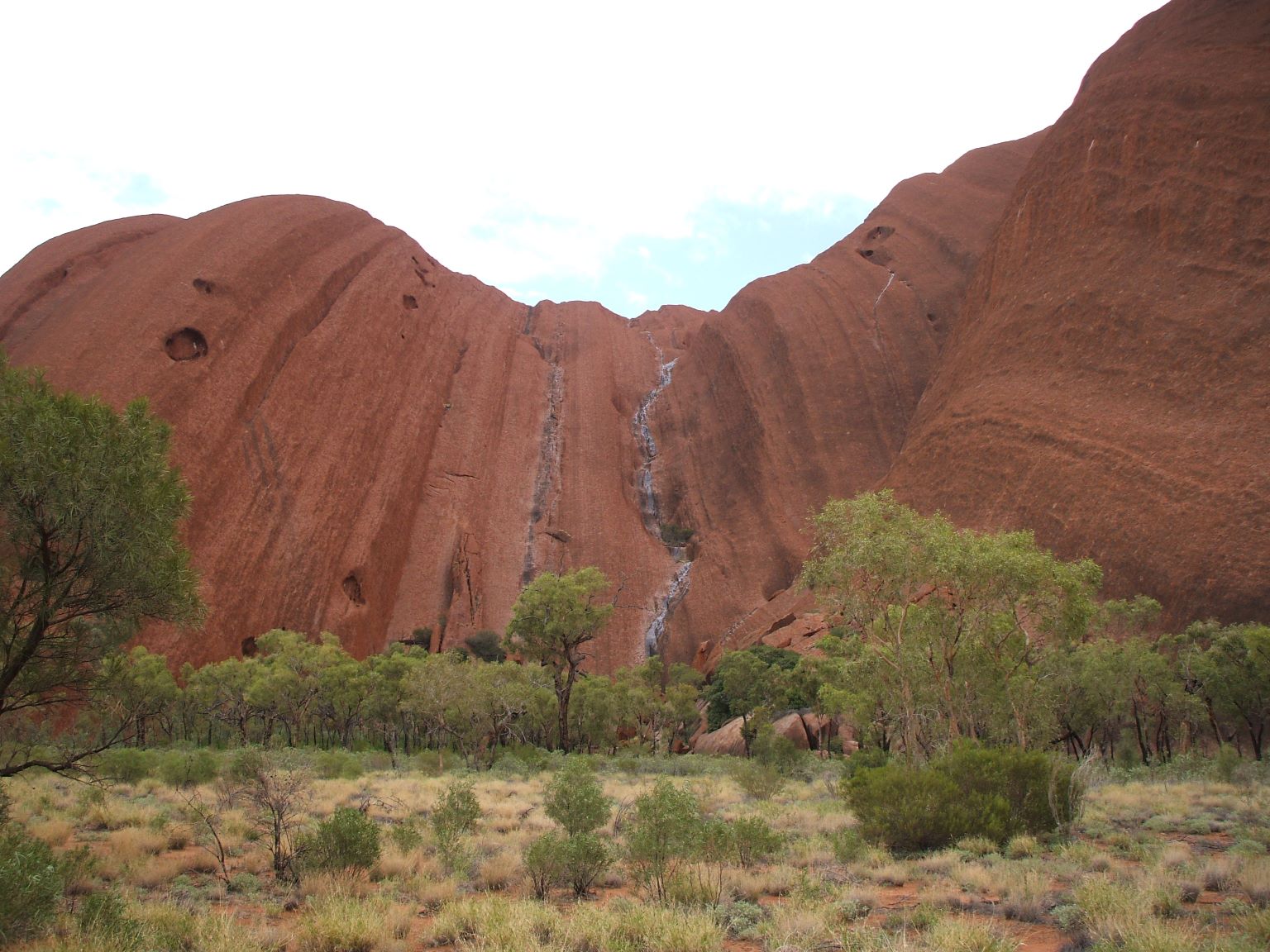 Rain streaming down the face of Uluru!