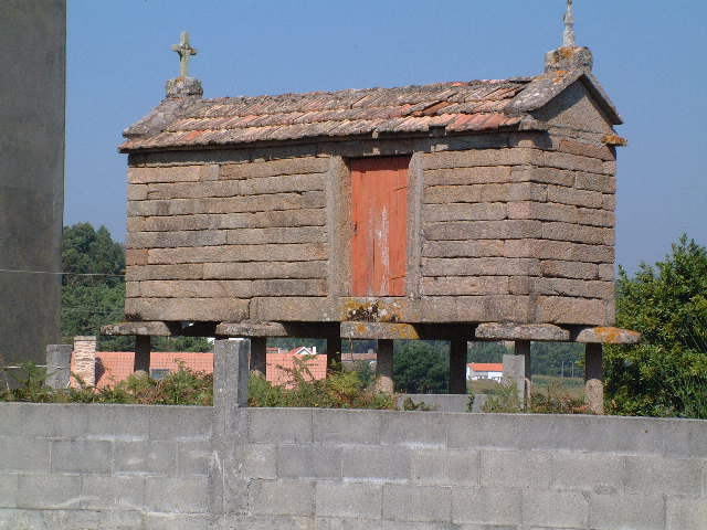 
An old stone grain store raised off the ground.