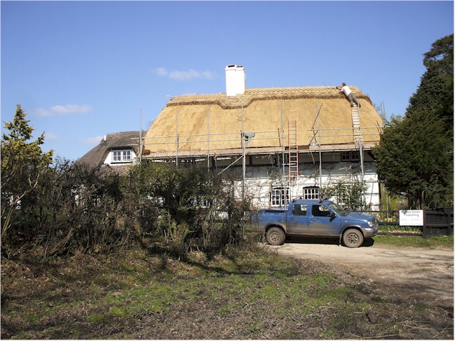 
A new thatch roof being done.
