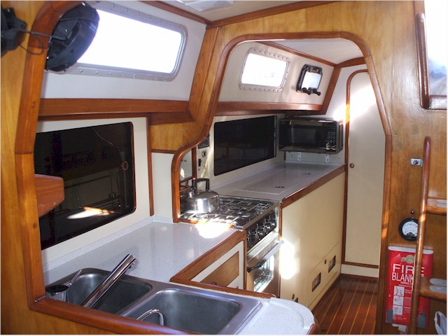 Galley with new counter tops, microwave, oven and taps!
