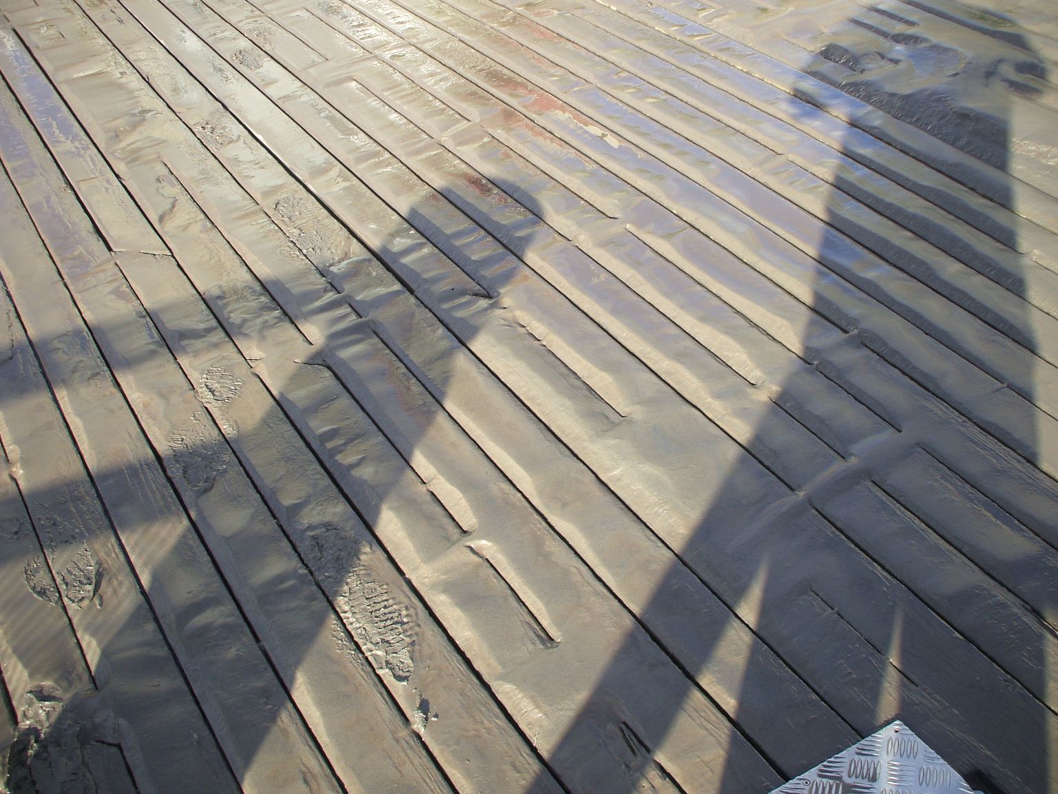 As the waters recede back into the river, the sticky, slippery, smelly mud is left behind...
