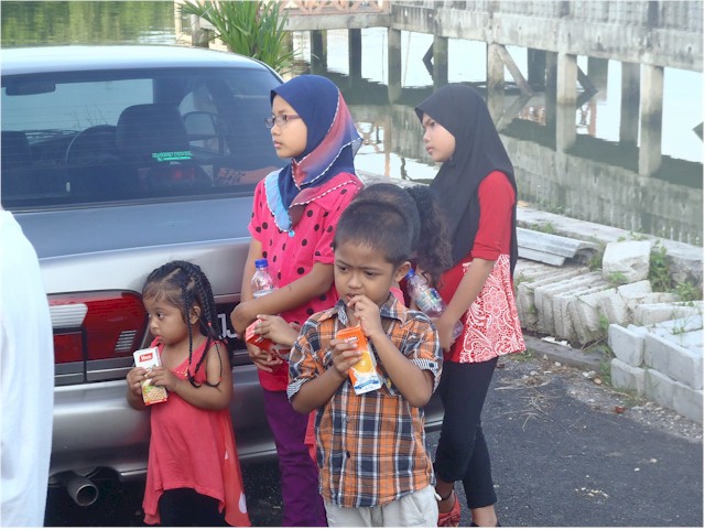 The younger village children watched in bemusement.
