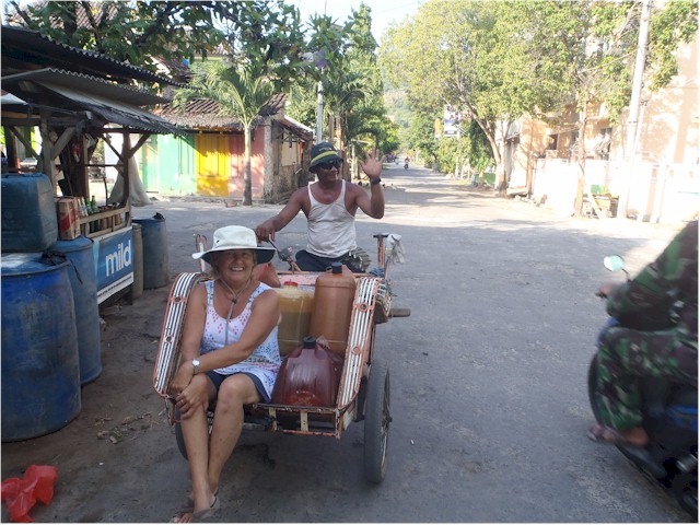 ... and transporting the jerry cans back to the dock by local trishaw!
