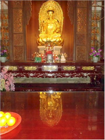 ... complete with immense gold buddhas...
