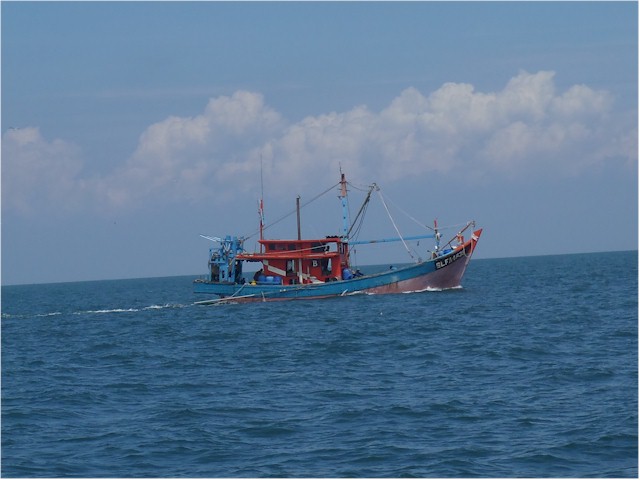 En route from Port Dickson to our next stop at Pangkor - more fishing boats!
