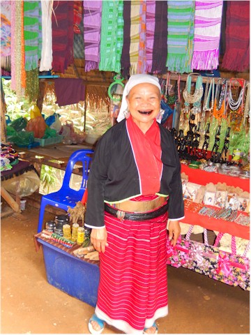 And this old lady proudly shows off the results of chewing betel nut for years - red teeth and happiness!
