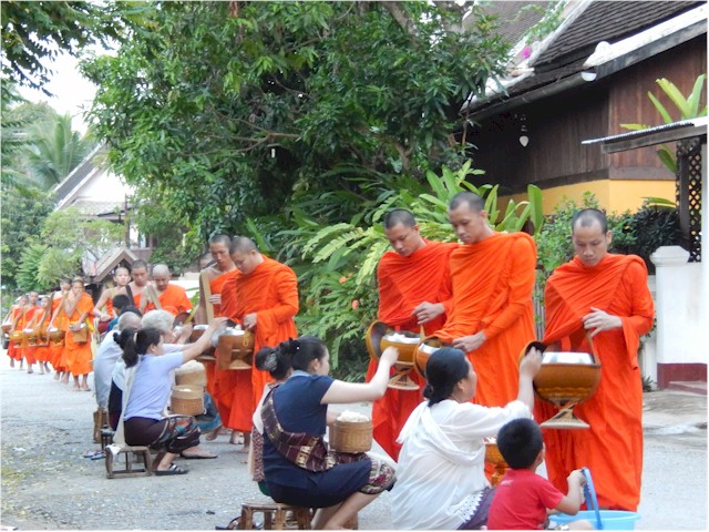 It appeared mainly to be cooked rice or fruit which was given. Then taken back to the monasteries for eating.

