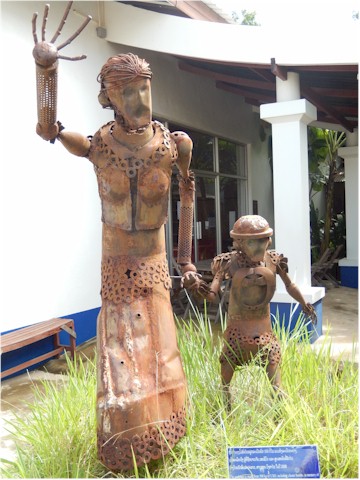This sculpture is made from war debris and shows that the victims include women and children. A sad but inspiring memory of Laos.