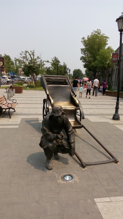 
The rickshaw man.
