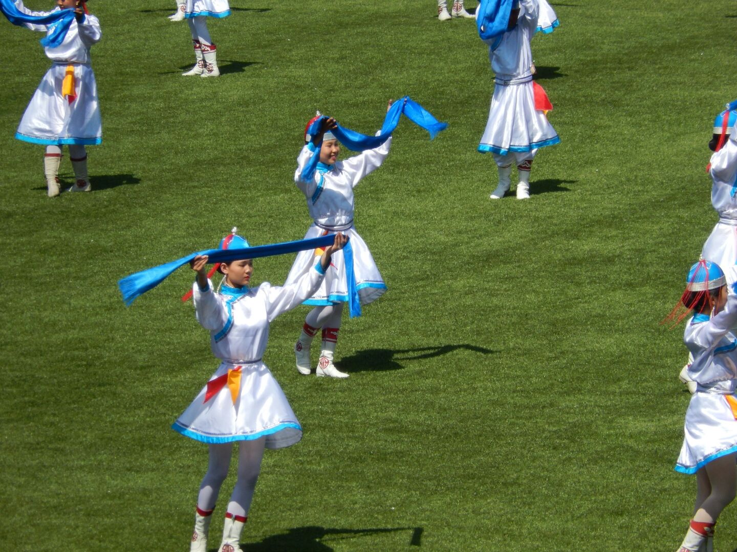 The young girls in traditional costume.