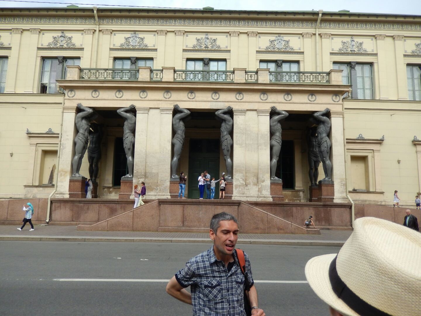 
The façade of the New Hermitage building has 15 giant statues of Atlas - that's our tour guide at the front.