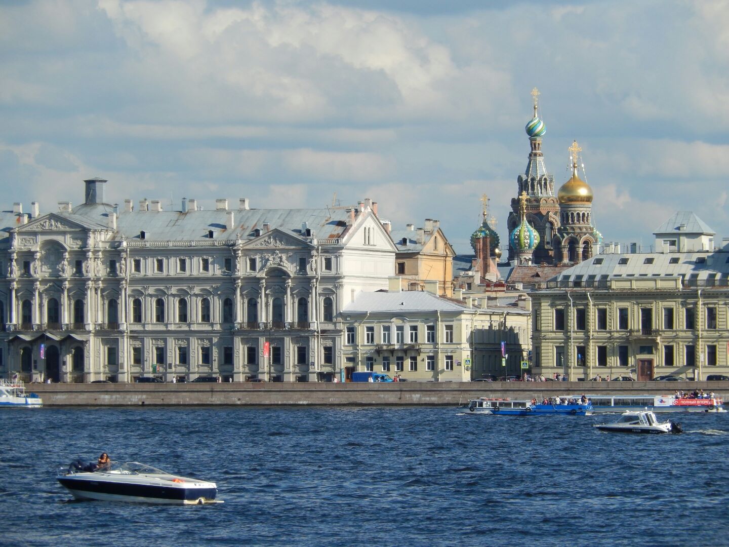 Looking back to St Petersburg across the river to the Hermitage with the domes of the Church of the Saviour of the Spilled Blood in the background.
