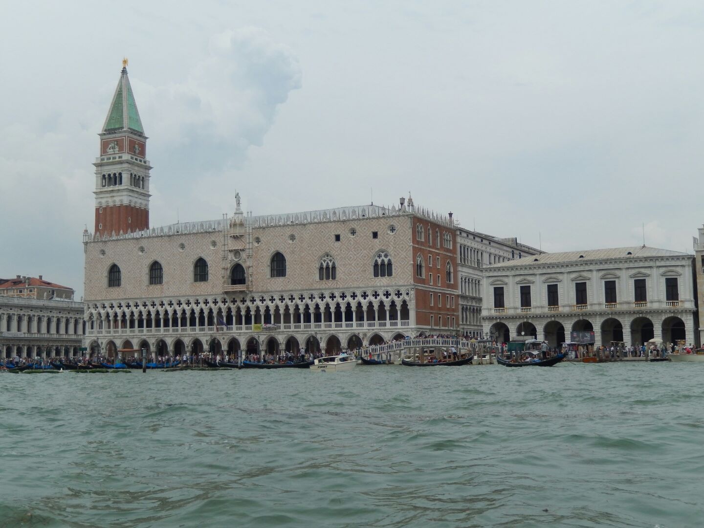 View from the vaporetto (water bus). Formerly the Doge’s residence and the seat of Venetian government, the Palace is the very symbol of Venice and a masterpiece of Gothic architecture