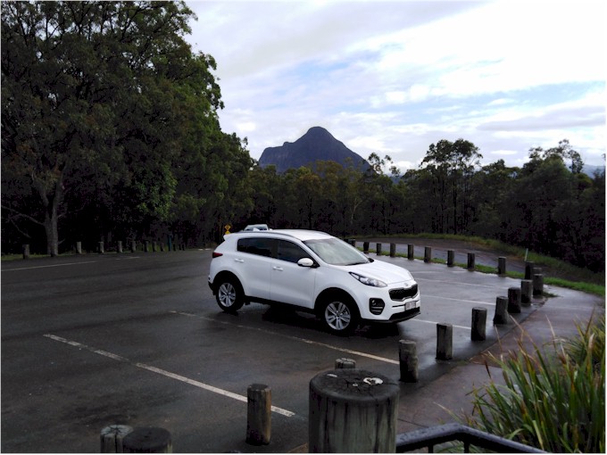 The Glasshouse Mountains are about a 30 minute drive inland (that's our car).