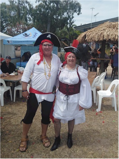 In our pirate outfits!